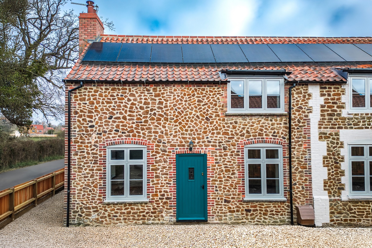 Beautiful stone cottage with traditional flint and brick construction